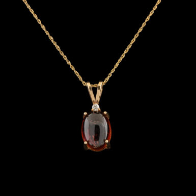 Pre-Owned Garnet & Diamond Pendant in 14K